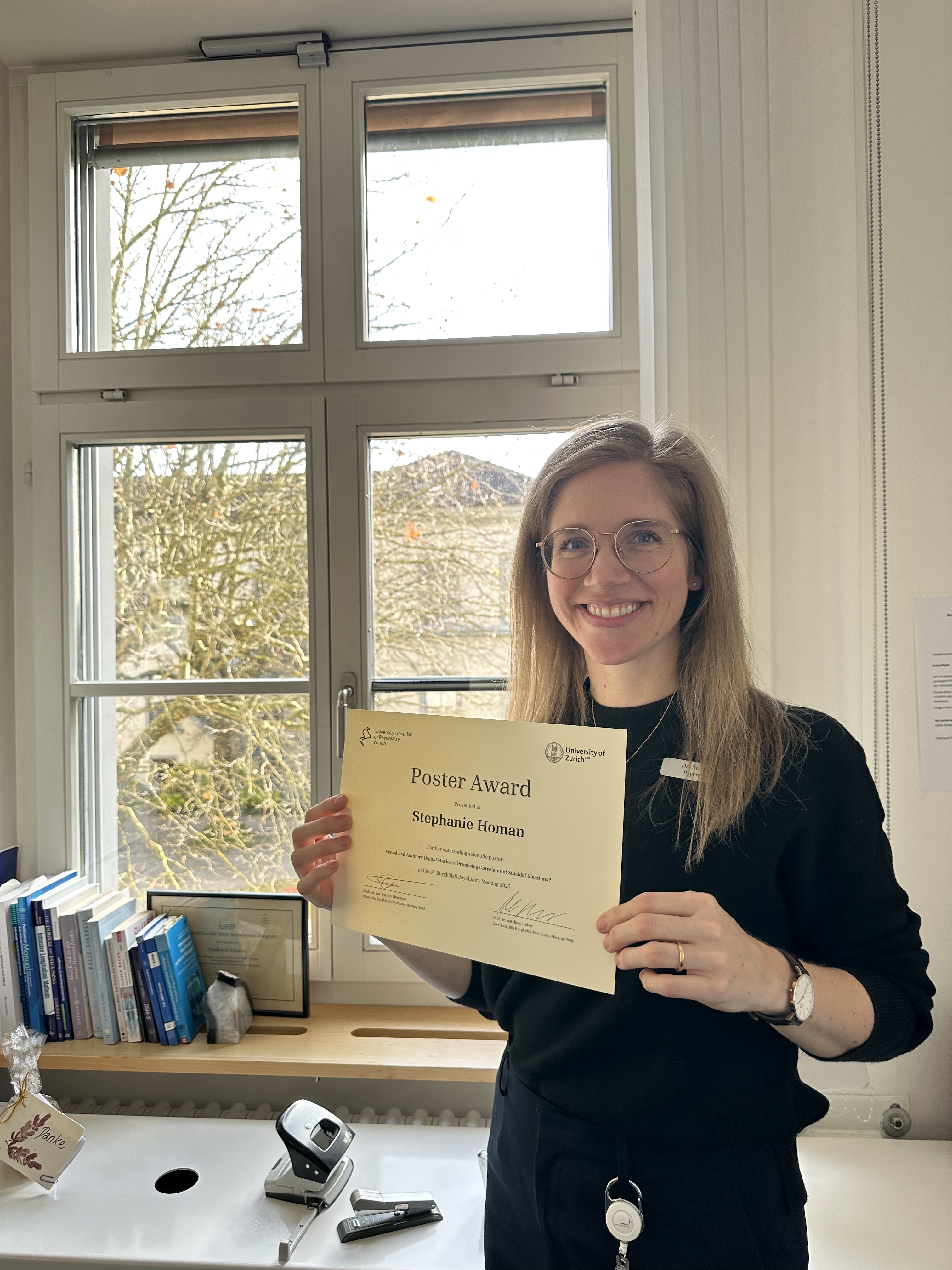 Dr. Stephanie Homan with Award